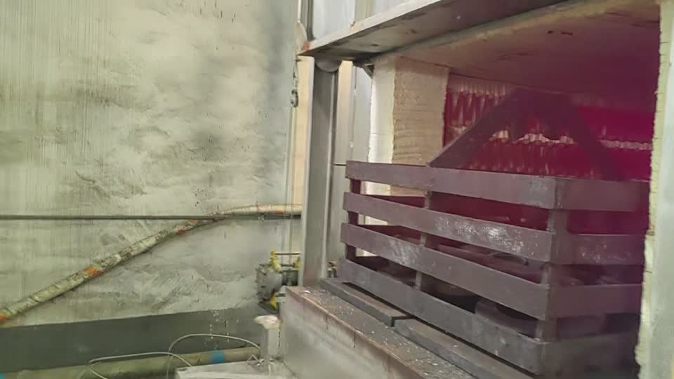 Material handling at the furnace — field footage still (VD-013)