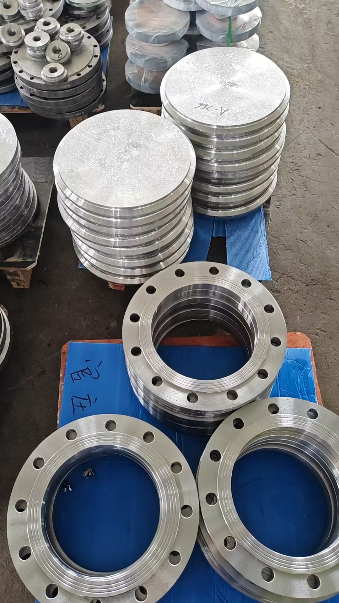 Machined metal part on workshop floor — field photo (2026-08)